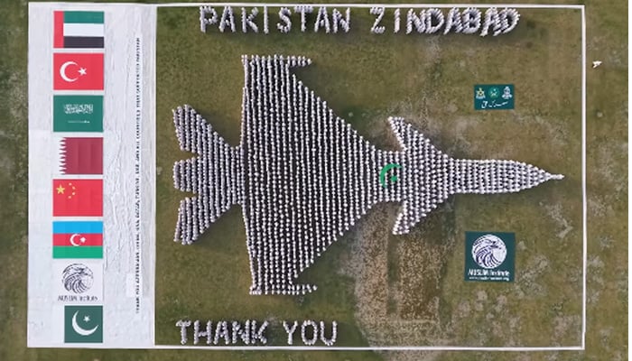 Human formation of J-10C fighter jet exhibited by Jhang citizens at Shrine of Hadrat Sultan Bahoo in Shorkot. — Screengrab via Geo News